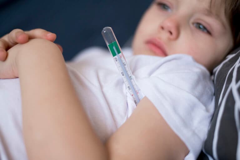 a child measures temperature