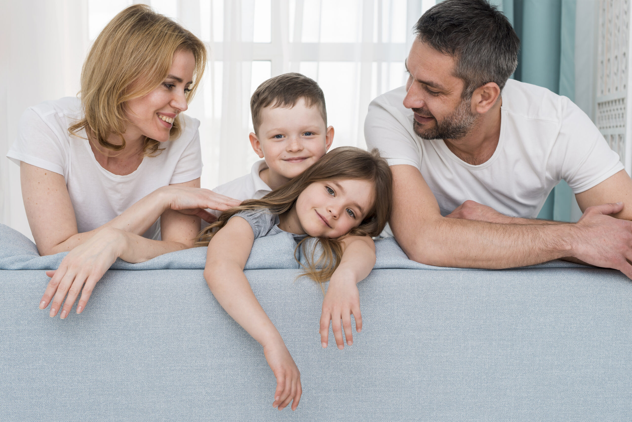 Family spending quality time together at home, symbolizing nurturing and happy parenting